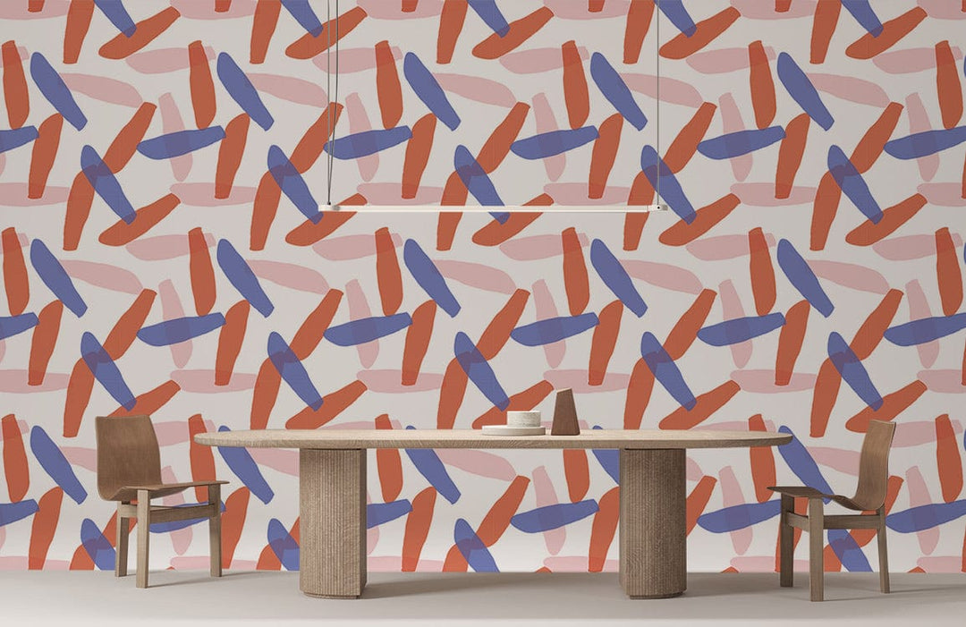 Geometric red and blue wallpaper, modern dining room, wooden table and chairs, minimalist lighting fixture.