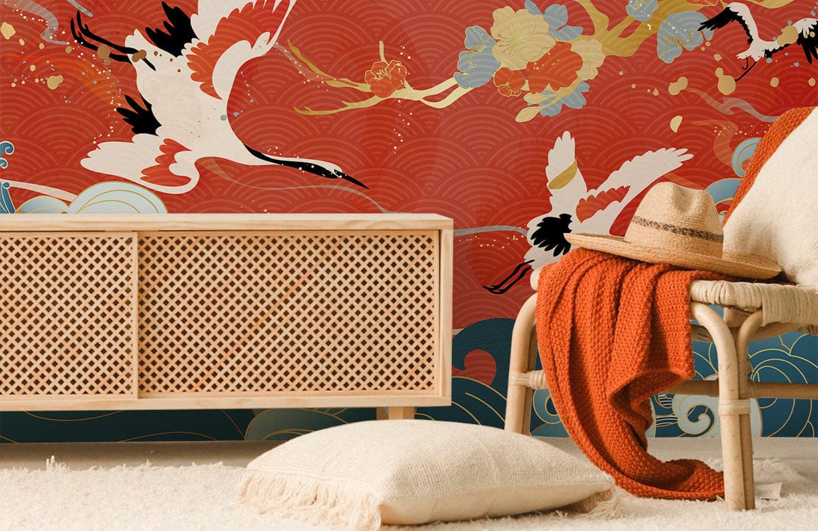 Japanese Crane Serenity Mural Wallpaper, wicker cabinet, cosy chair with orange throw and pillow, cream rug.