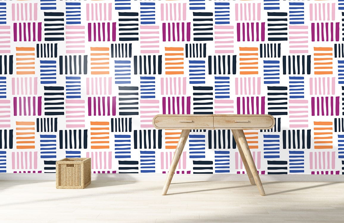 Vibrant geometric stripe wallpaper with wooden desk, wicker basket, light wood flooring in modern room.