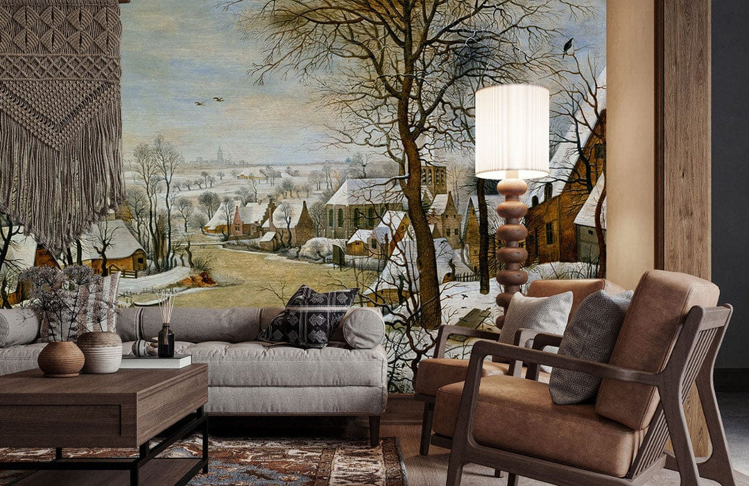 Vintage winter village mural wallpaper, beige sofa, brown armchair, wooden table, living room setting.