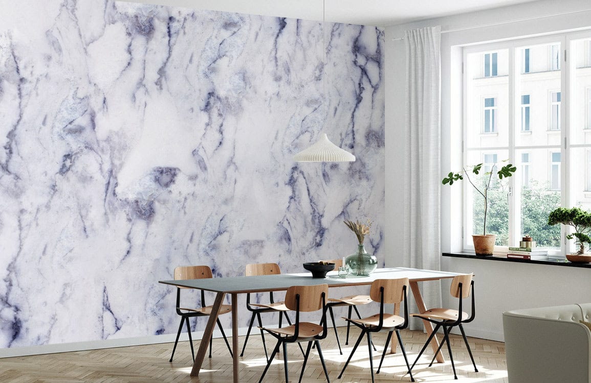 Elegant marble-effect wallpaper in modern dining room, wooden chairs, light wood flooring, sleek furniture.