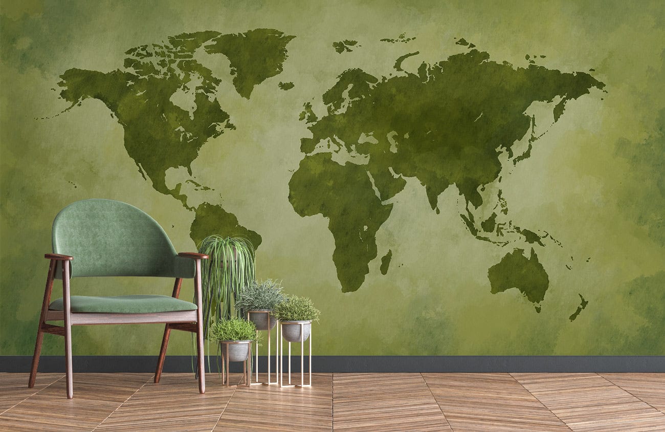 Vintage Green World Map Mural on patterned wood floor, green armchair in stylish living room decor.