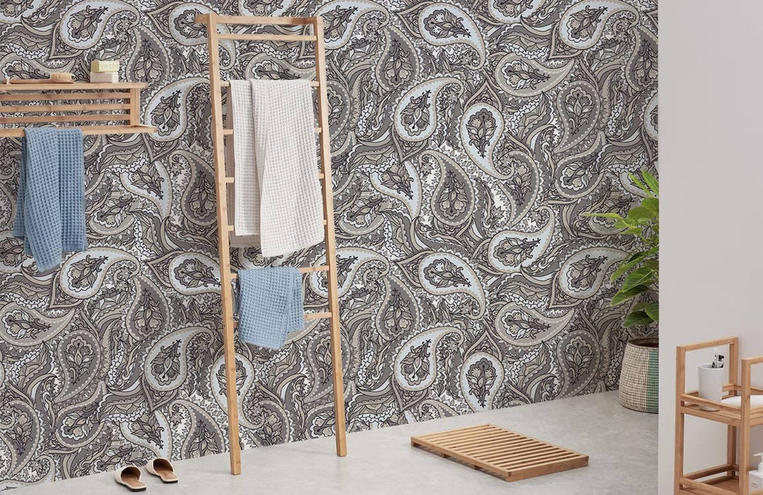 Elegant grey paisley wallpaper in modern bathroom, with wooden towel rack and light flooring.