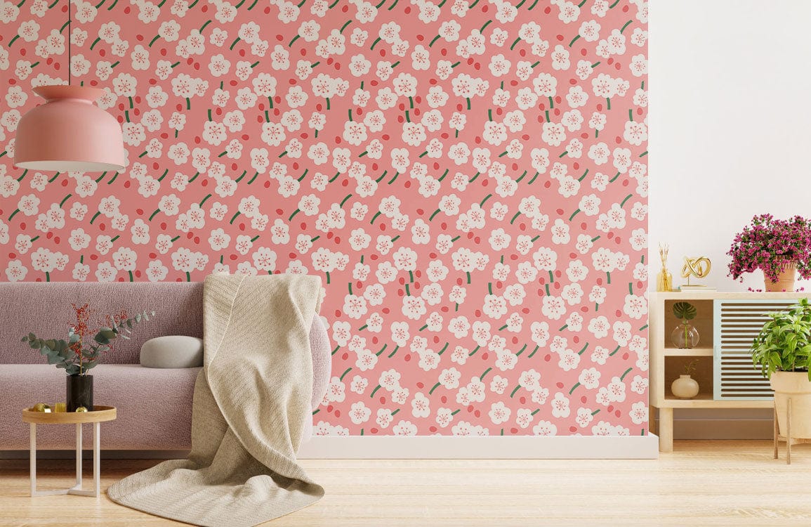 Romantic pink floral blossom wallpaper in elegant living room; pink pendant light, beige sofa, wood flooring.