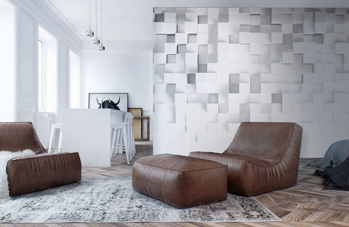 Modern white geometric 3D wall mural, brown leather chairs, herringbone wood floor, and stylish decor.