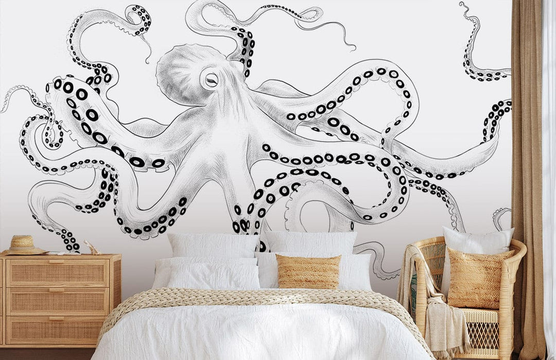 Monochrome ink octopus mural wallpaper in bedroom with wicker furniture, white bedding, beige curtains.