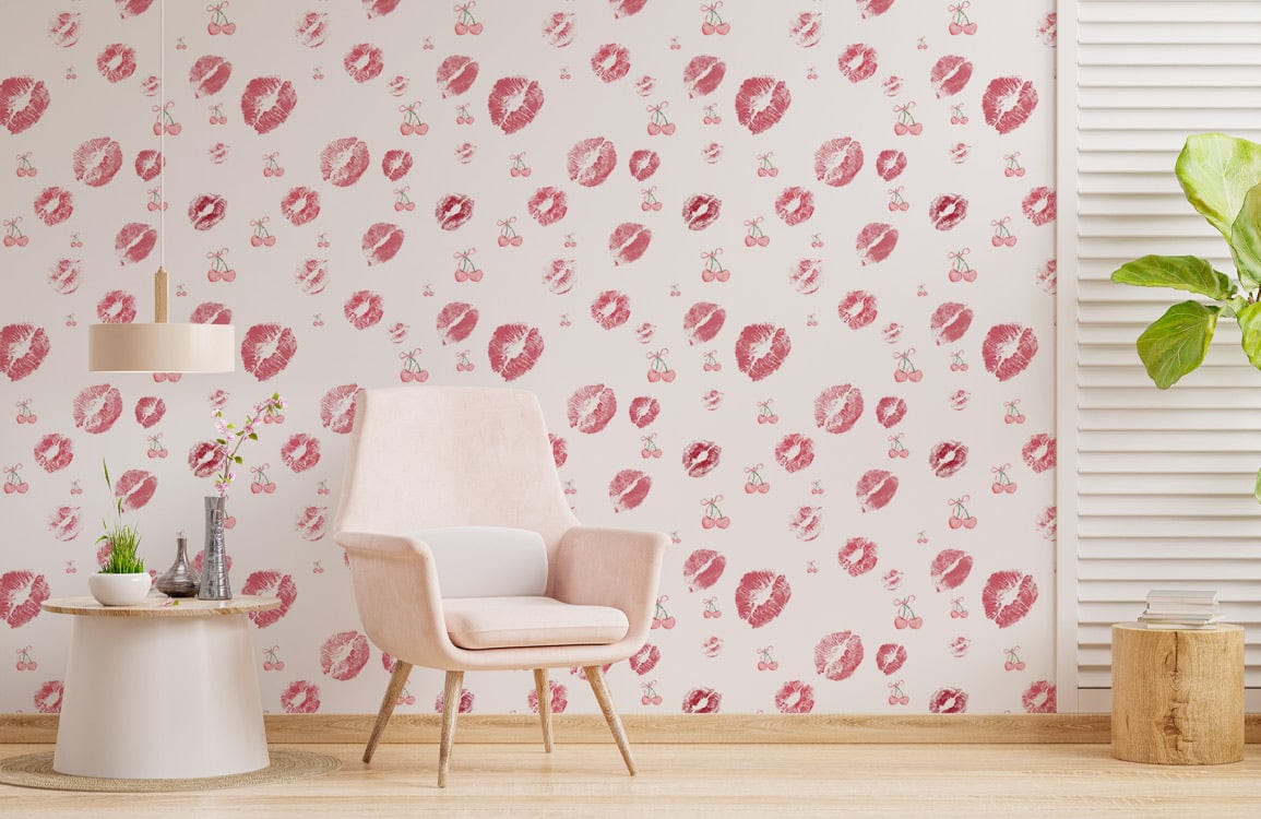 Red and white wallpaper with kiss print pattern, pink armchair, wooden flooring, modern room style.