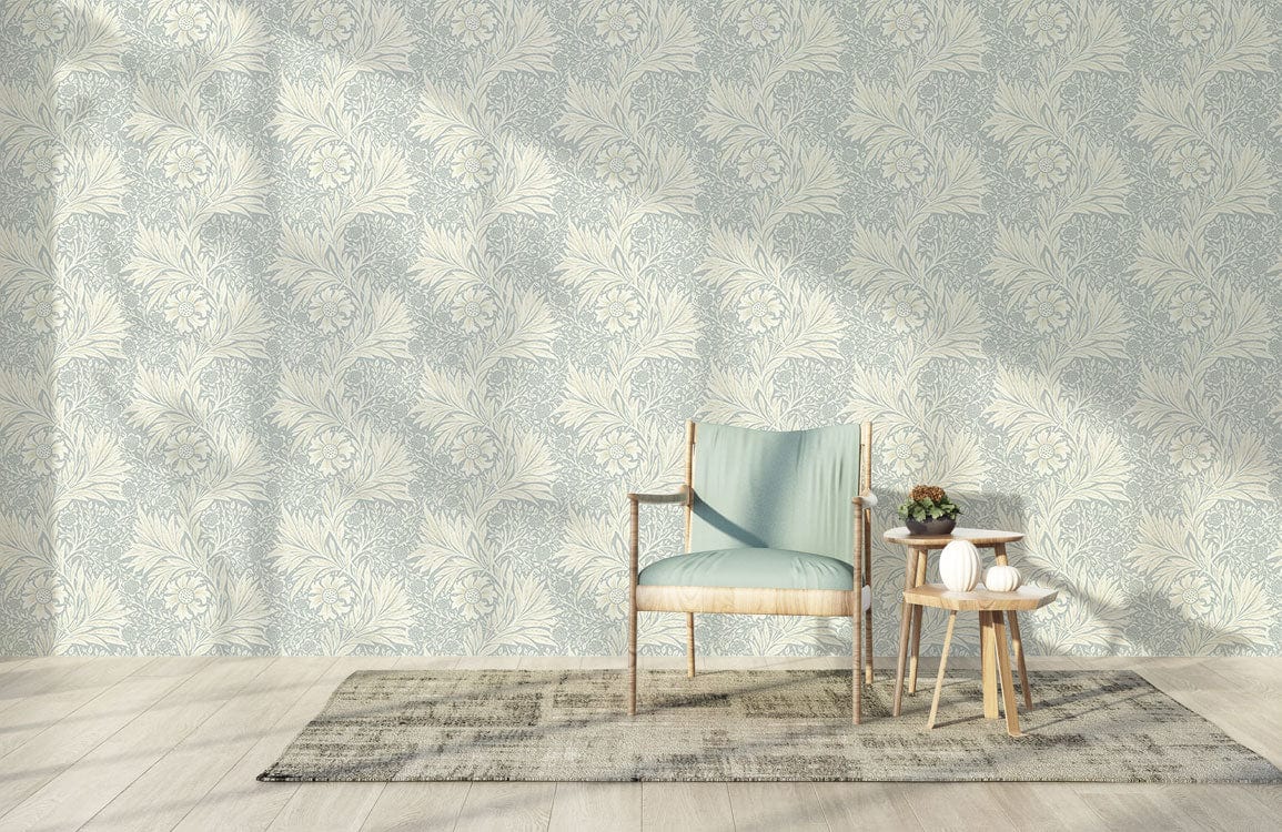 Elegant floral sage green wallpaper with wooden chair, light teal cushion, and neutral rug in living room.