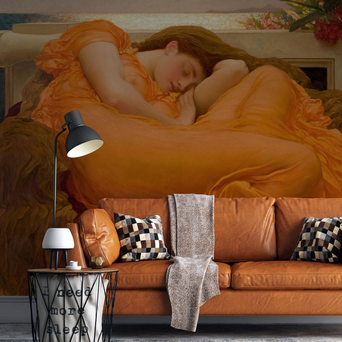 Luxurious Renaissance wallpaper with a peach goddess mural, dark grey wall, orange leather sofa, floor lamp.