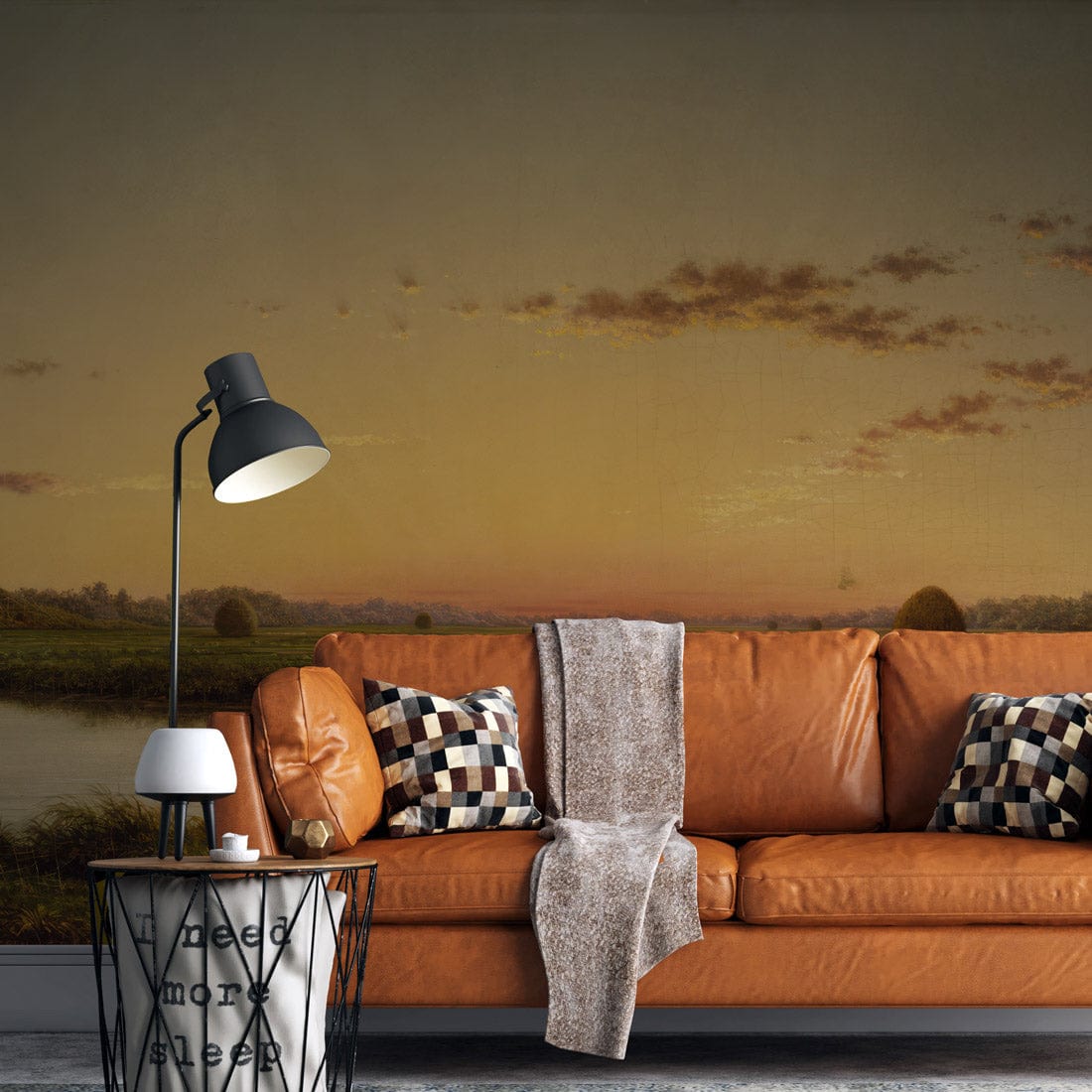 Orange sofa, Serene Countryside Sunrise Mural, contemporary lamp, dark flooring in a modern living room.