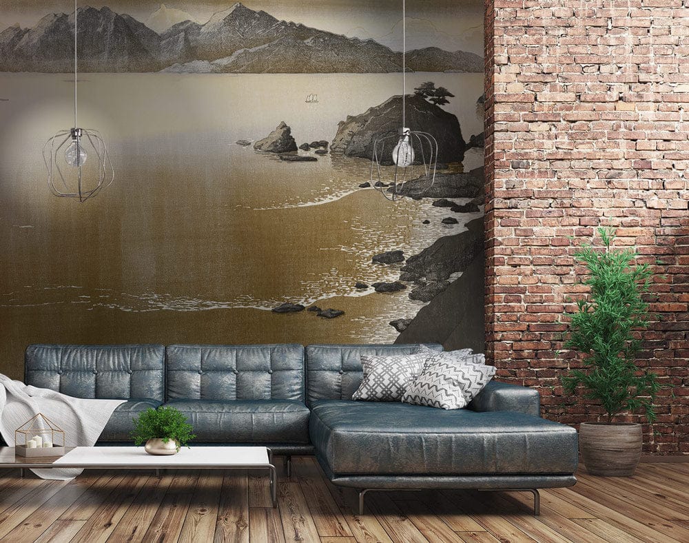 Alt text: Serene Sepia Mountain Wall Mural in a living room with grey sofa, wooden flooring, brick wall.