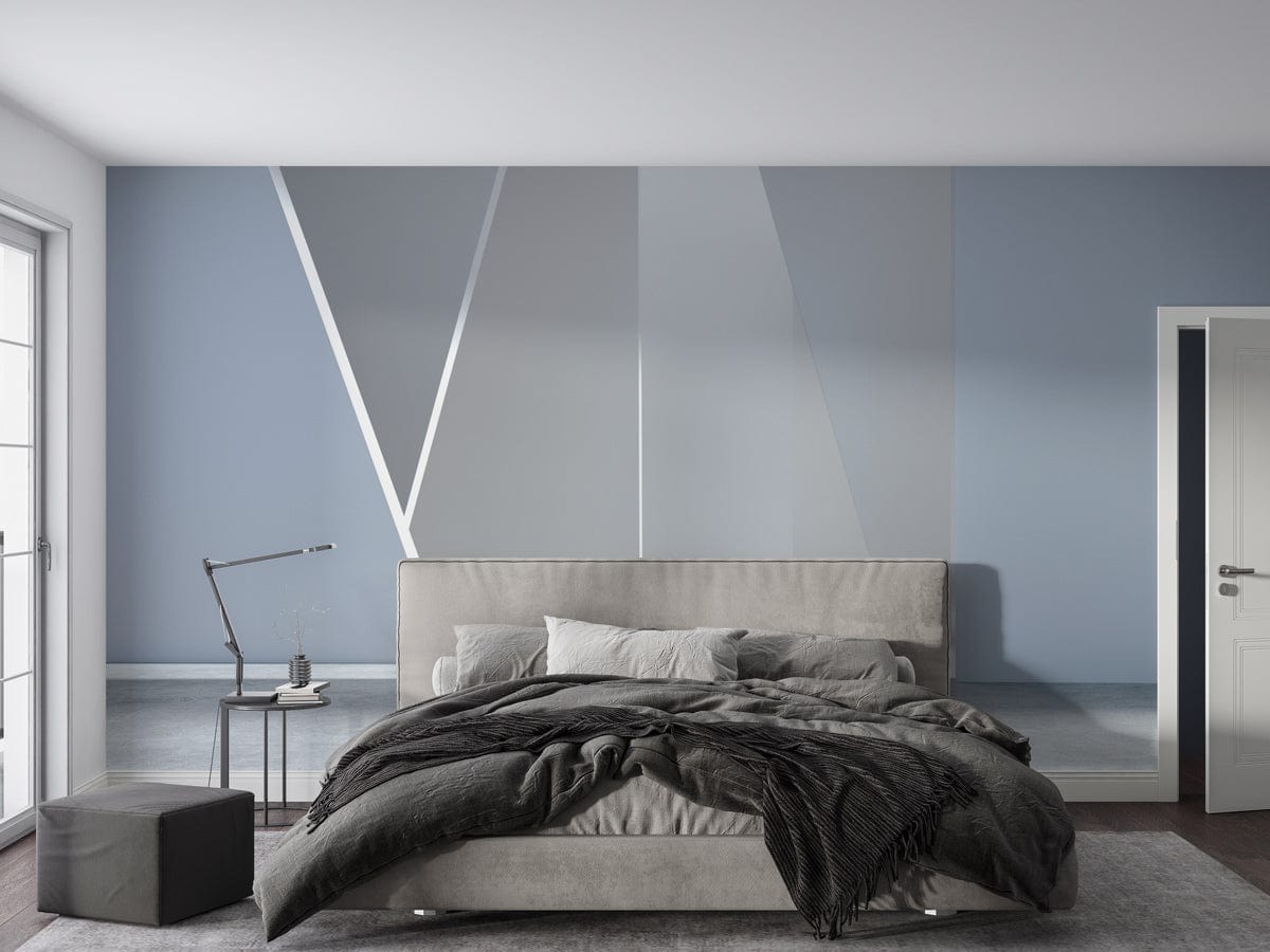 Contemporary grey geometric mural wallpaper in modern bedroom with minimalist grey bed and sleek floor lamp.