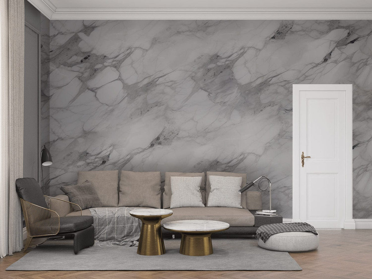 Elegant grey marble effect wallpaper in modern living room with beige sofa and gold accent tables.