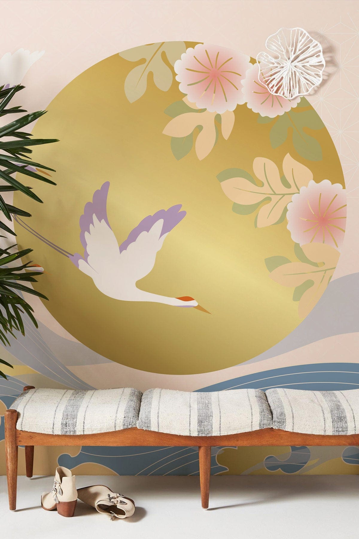 Elegant Oriental wallpaper in pastel and gold, featuring birds and waves, with stylish wooden bench.