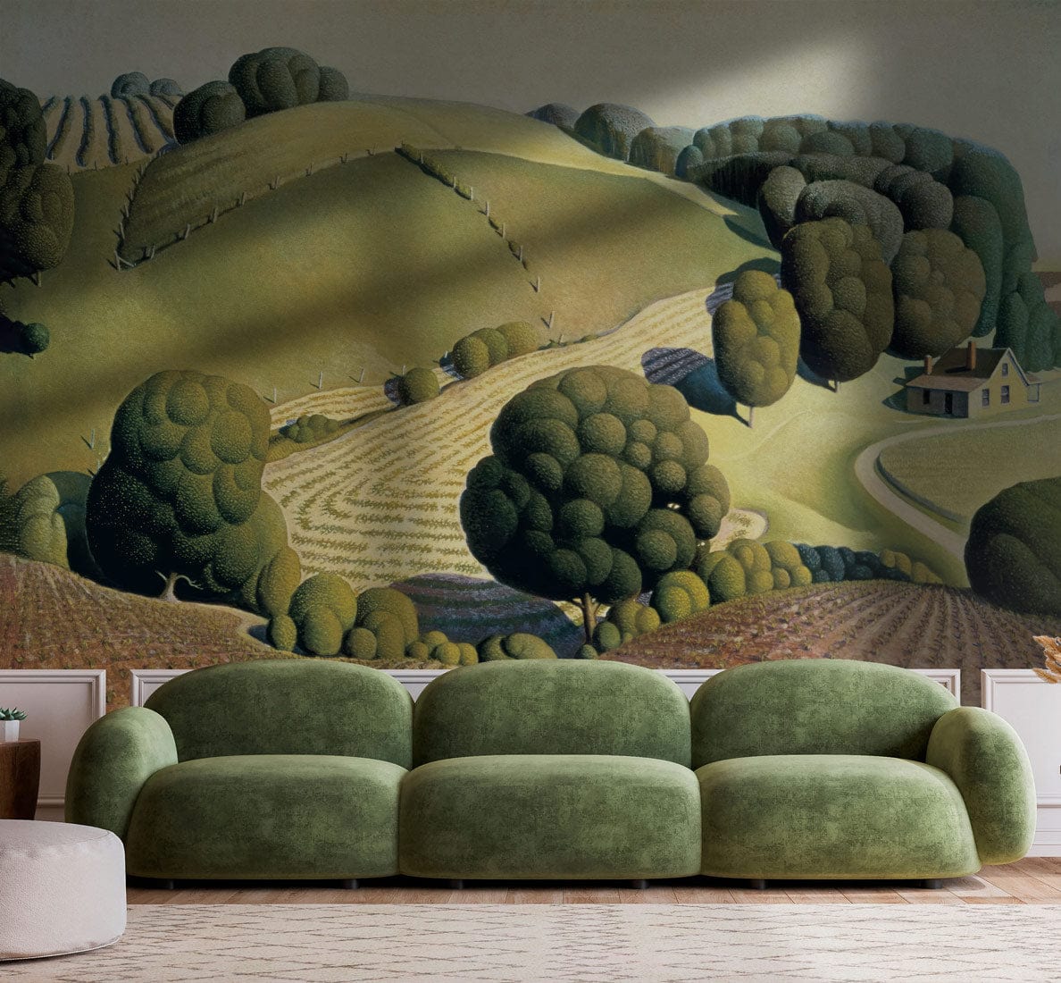 Countryside Charm wallpaper in green tones, featuring vintage pastoral landscape, plush green sofa, wooden flooring.