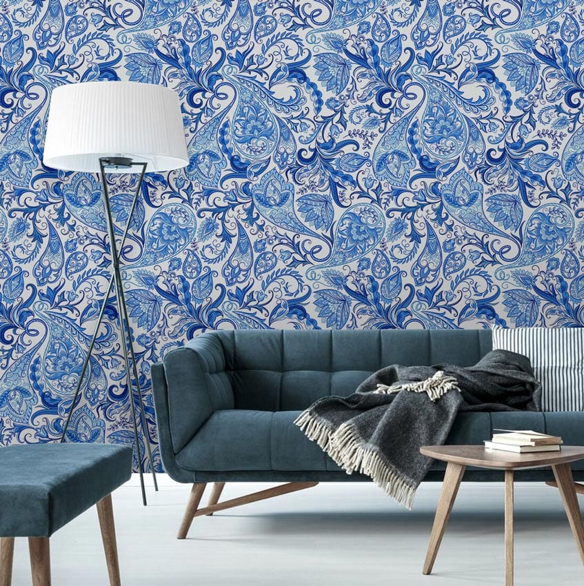 Blue Floral Paisley wallpaper, vintage design; stylish living room with teal sofa, elegant floor lamp.