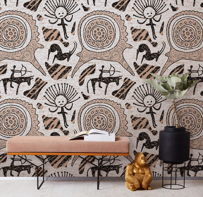 Rustic tribal pattern wallpaper with earth tones, pink velvet bench, gold teddy bear decor, grey flooring.