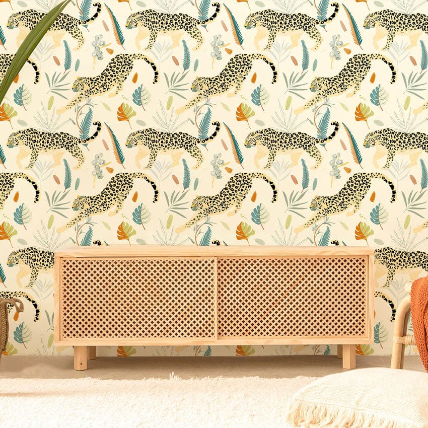 Elegant jungle leopard print wallpaper in living room with wooden cabinet, cream background, cosy decor.