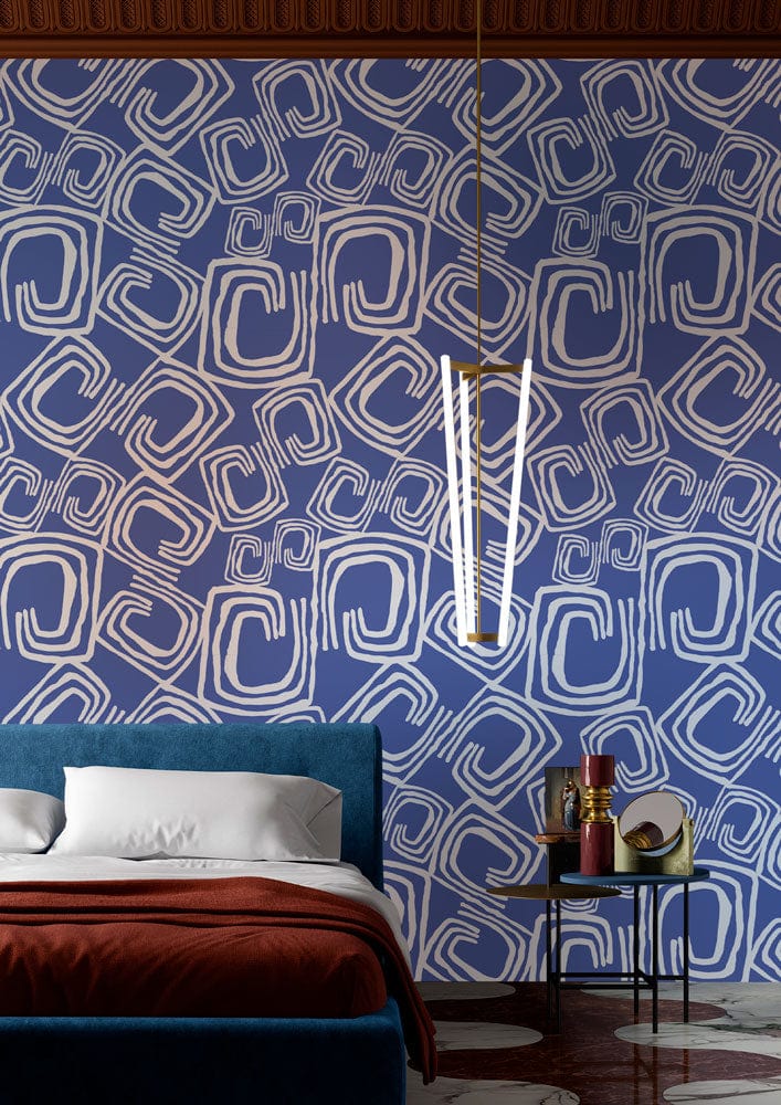 Abstract blue geometric pattern wallpaper, modern bedroom, blue velvet bed, bedside table, pendant light.