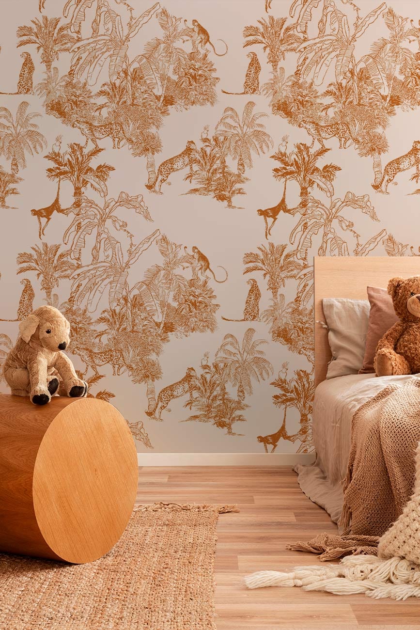 Vintage jungle wallpaper with rustic orange tropical safari design, wooden stool, neutral bed, cosy rug.