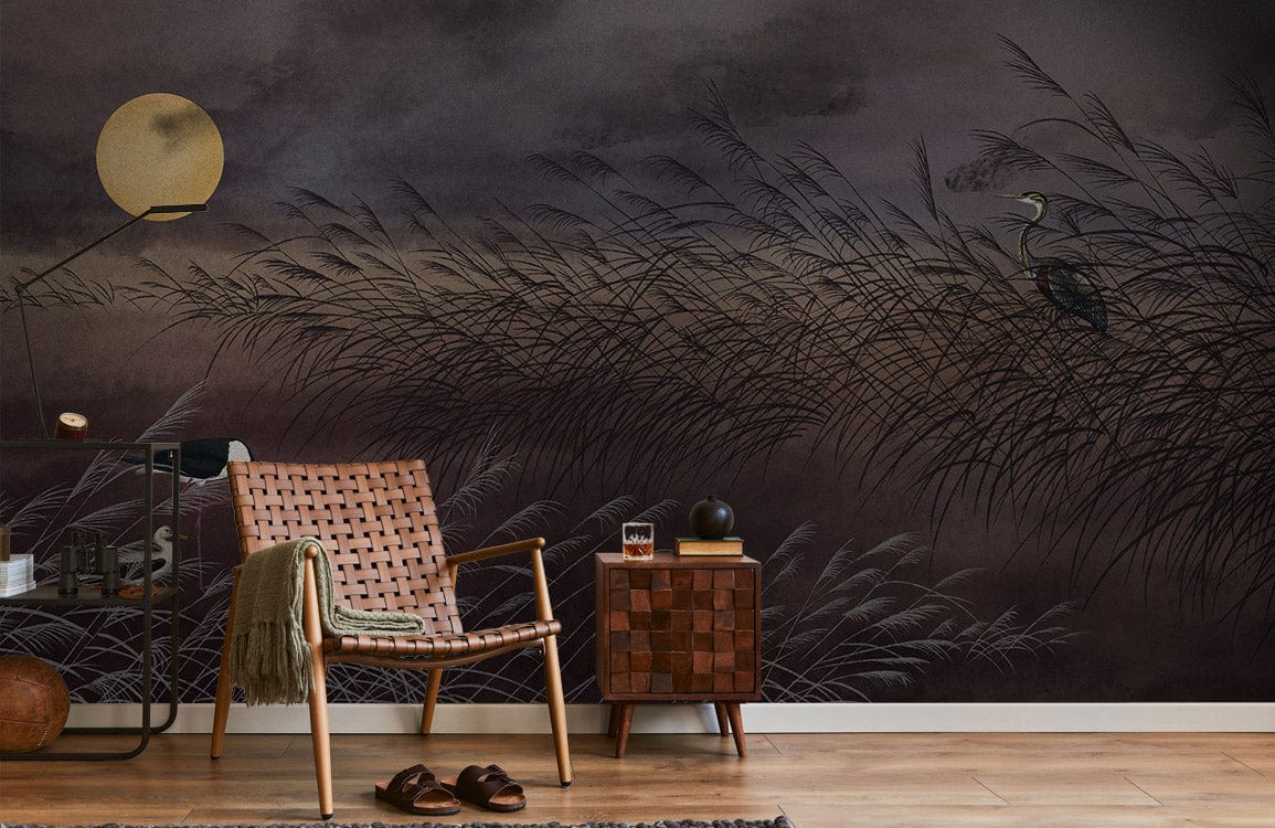 Tranquil Moonlit Heron Scene Mural Wallpaper with wicker chair, wooden side table, and wooden flooring.