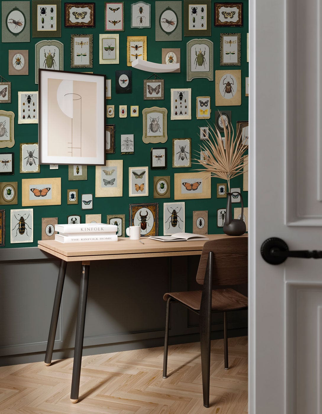 Vintage Insect Gallery Green Wallpaper with framed insects, wooden desk, and chair in study room.
