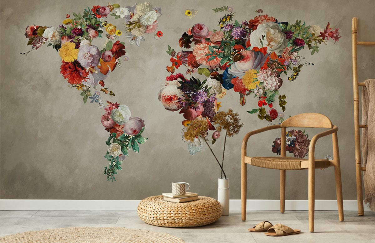 Elegant floral world map mural wallpaper with earthy tones, featuring wooden chair, beige walls, beige rug.