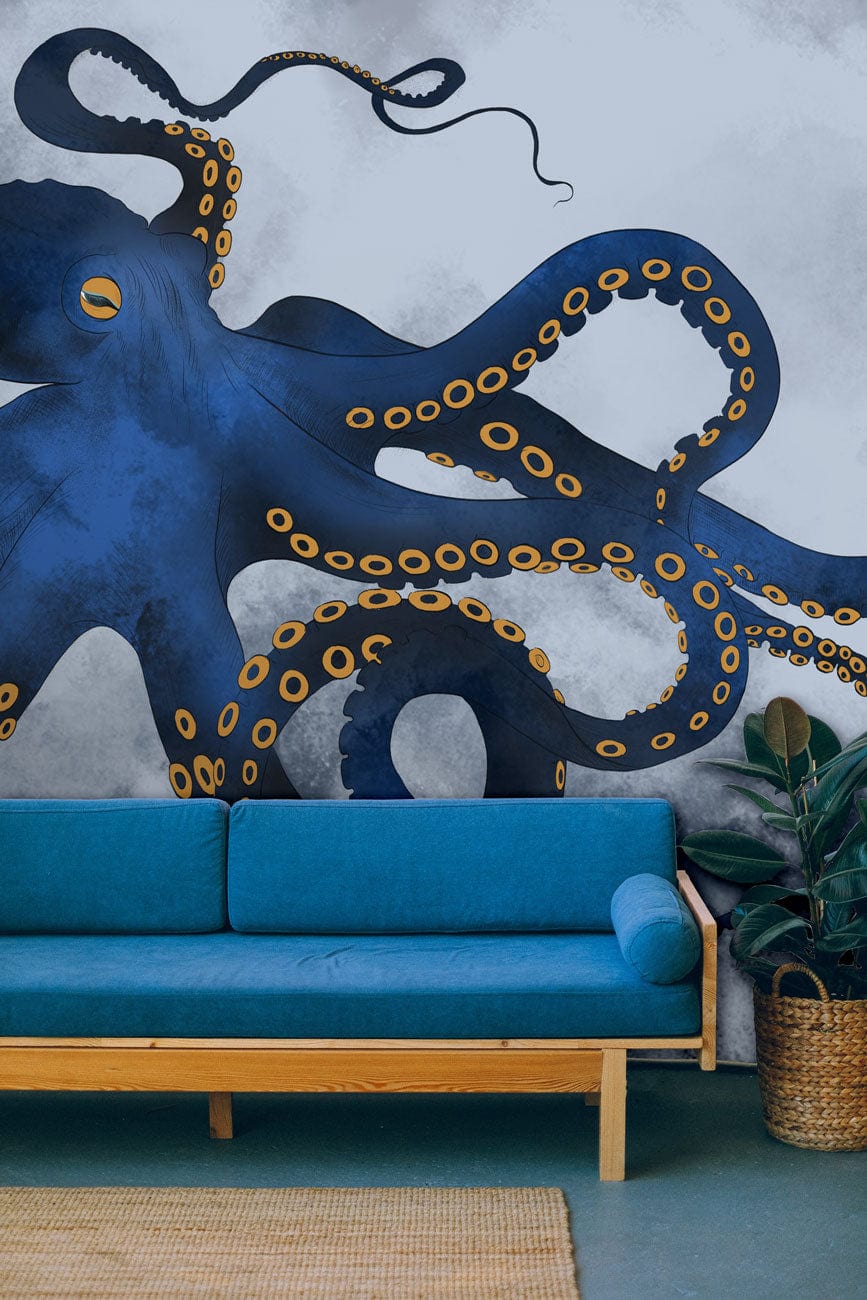 Deep Blue Ocean Octopus Mural Wallpaper in modern living room with blue sofa and green flooring.