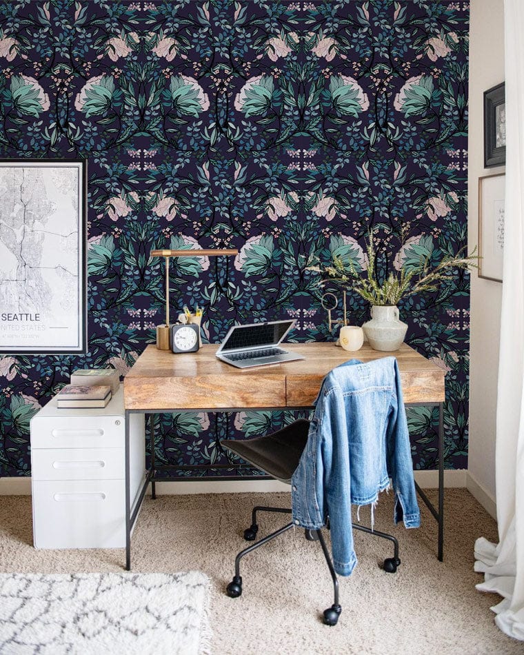 Luxurious botanical teal midnight floral wallpaper, wooden desk, black chair, office decor, neutral carpet.