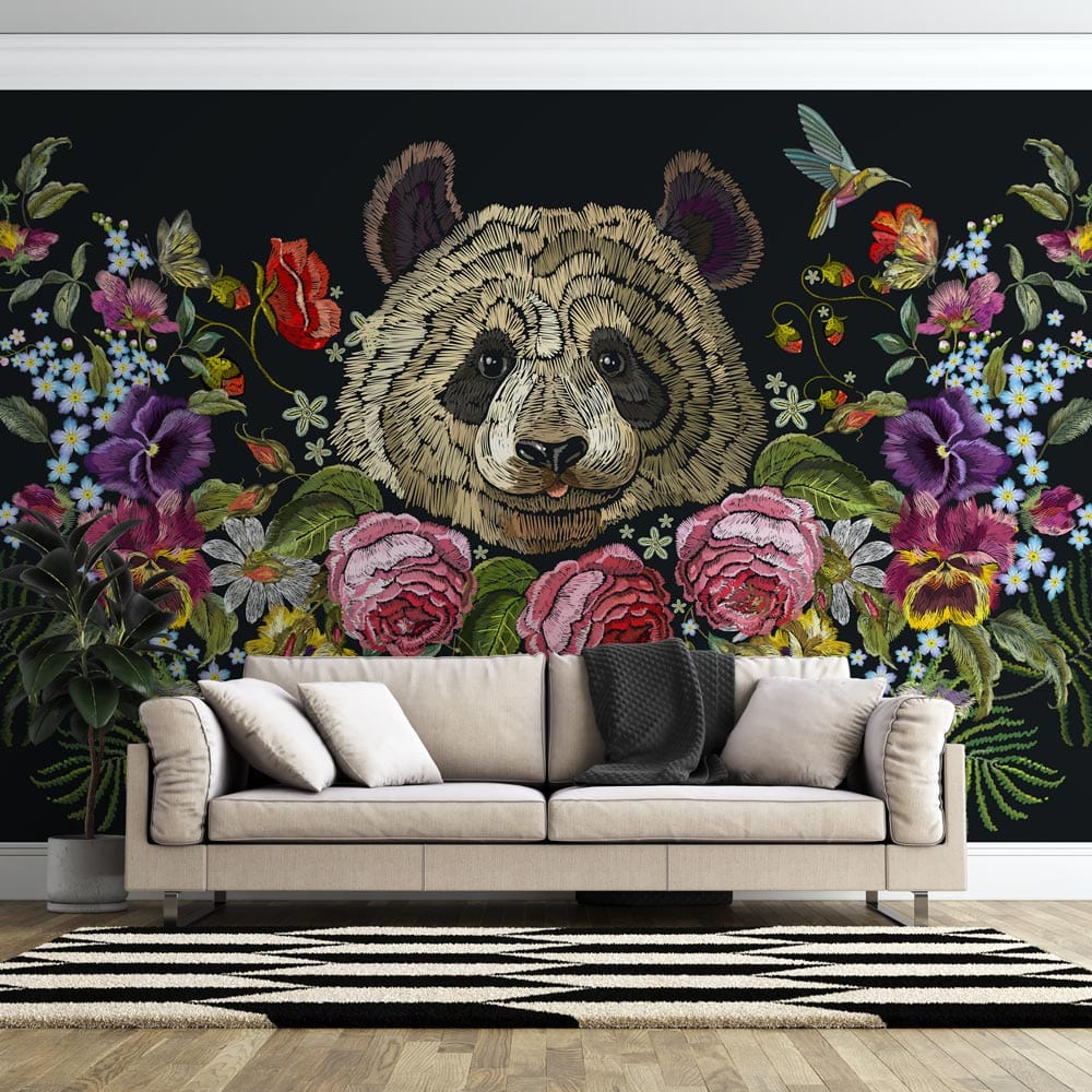 Colourful floral panda mural wallpaper with vibrant blooms, beige sofa, striped rug, wooden flooring.