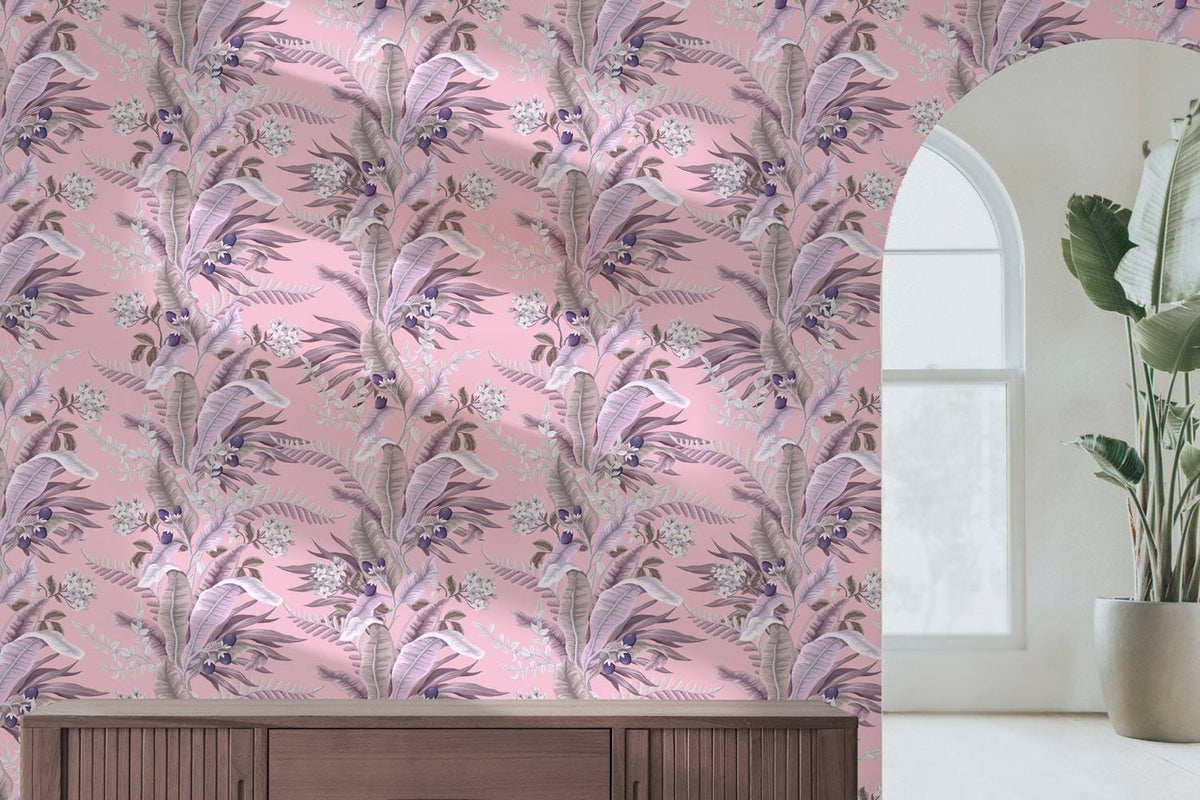 Pink botanical floral wallpaper in a living room with wooden sideboard, arched window, and plant decor.
