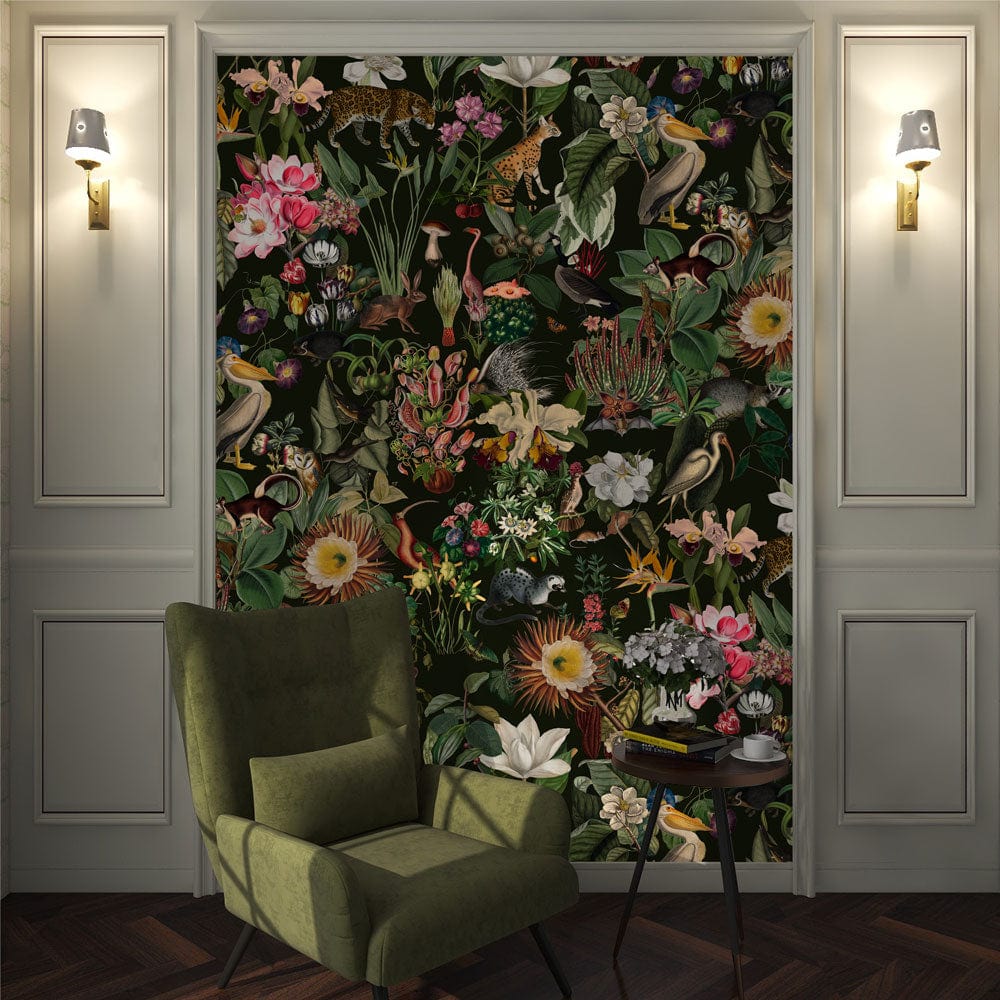 Tropical Jungle Paradise Floral Mural Wallpaper in cosy living room with green armchair, wooden flooring.