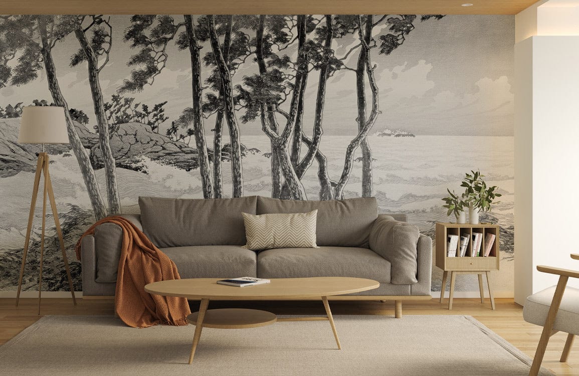 Monochrome coastal forest mural wallpaper in grey tones, grey sofa, wooden coffee table, cosy living room.