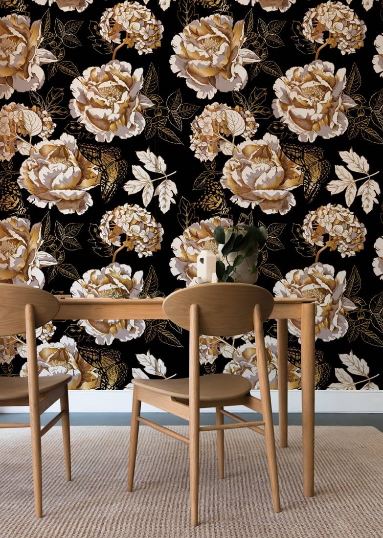 Elegant vintage floral wallpaper featuring gold and cream roses in dining room with wooden chairs.