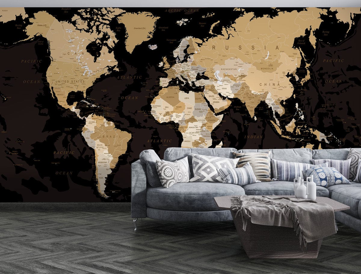Luxury living room with Vintage World Map Mural Wallpaper, featuring sectional grey sofa and herringbone flooring.