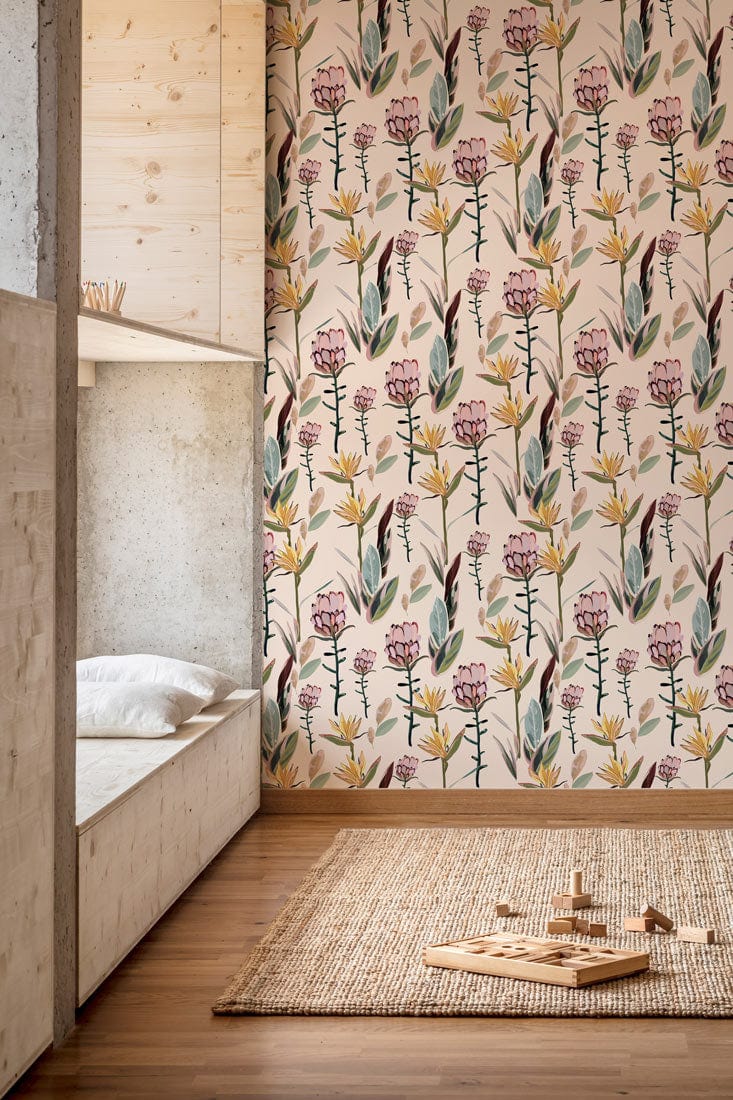 Vintage botanical wallpaper with soft pink blossoms, wooden bed, beige rug, hardwood flooring, modern bedroom.