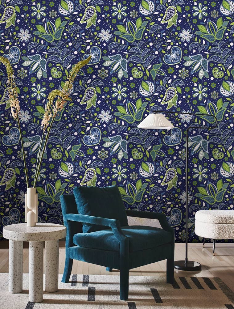 Midnight Blue Floral Fantasy Wallpaper, green leaves; teal chair, floor lamp, modern living room style.