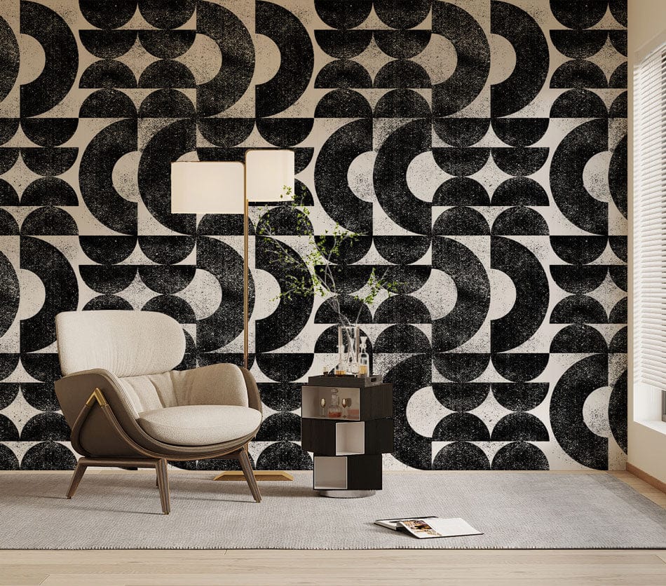 Retro geometric black and white wallpaper with armchair, modern table lamp, stylish rug in living room.