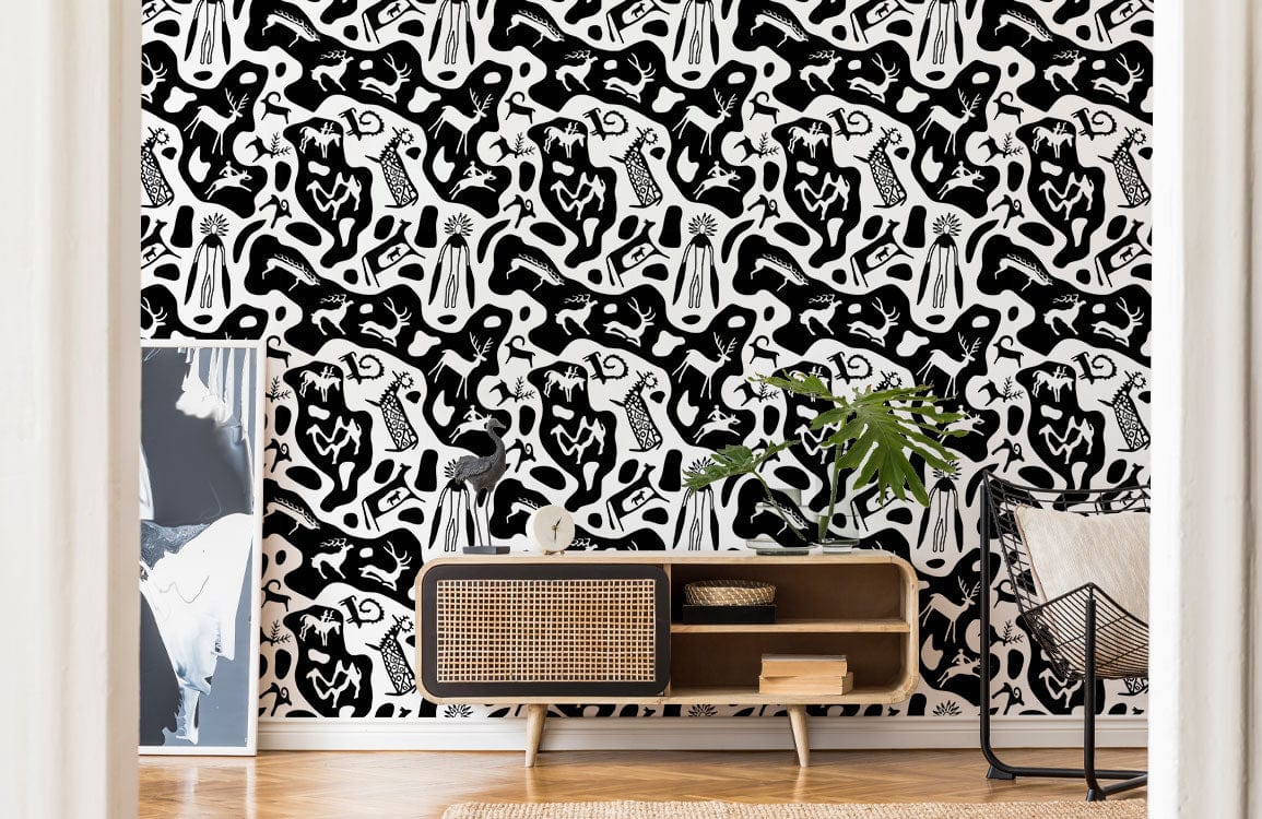 Monochrome Abstract Safari Art Wallpaper in living room; features rattan sideboard, modern chair, wooden floor.