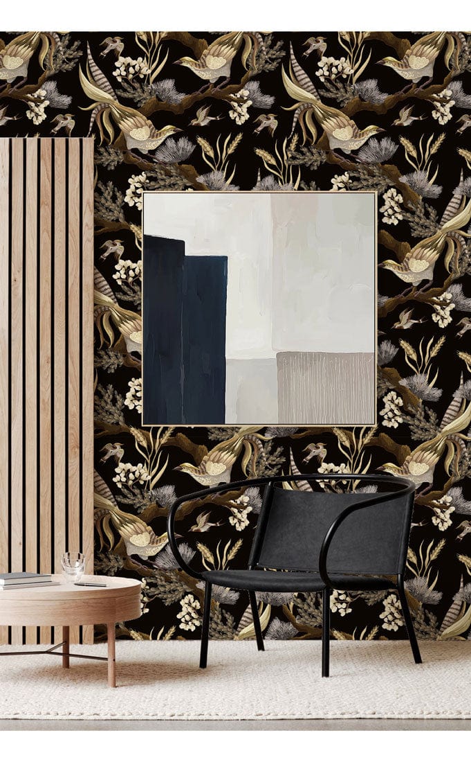 Elegant vintage black gold nature wallpaper, wooden accent panel, modern black chair, and abstract wall art.