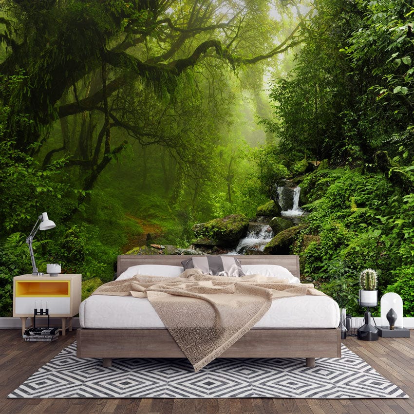 Mural wallpaper with forest stream, lush greenery; modern bedroom design, wood flooring, geometric rug.