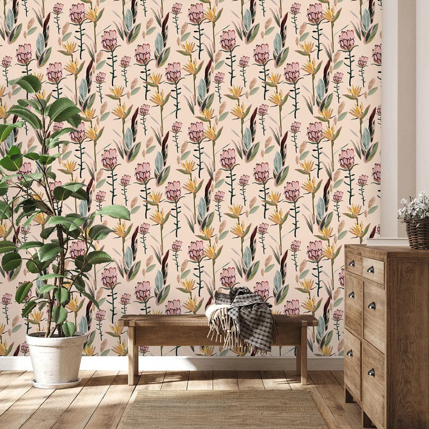 Vintage botanical wallpaper with pink blossoms, wooden bench, chest of drawers, wooden flooring, decorative plant.