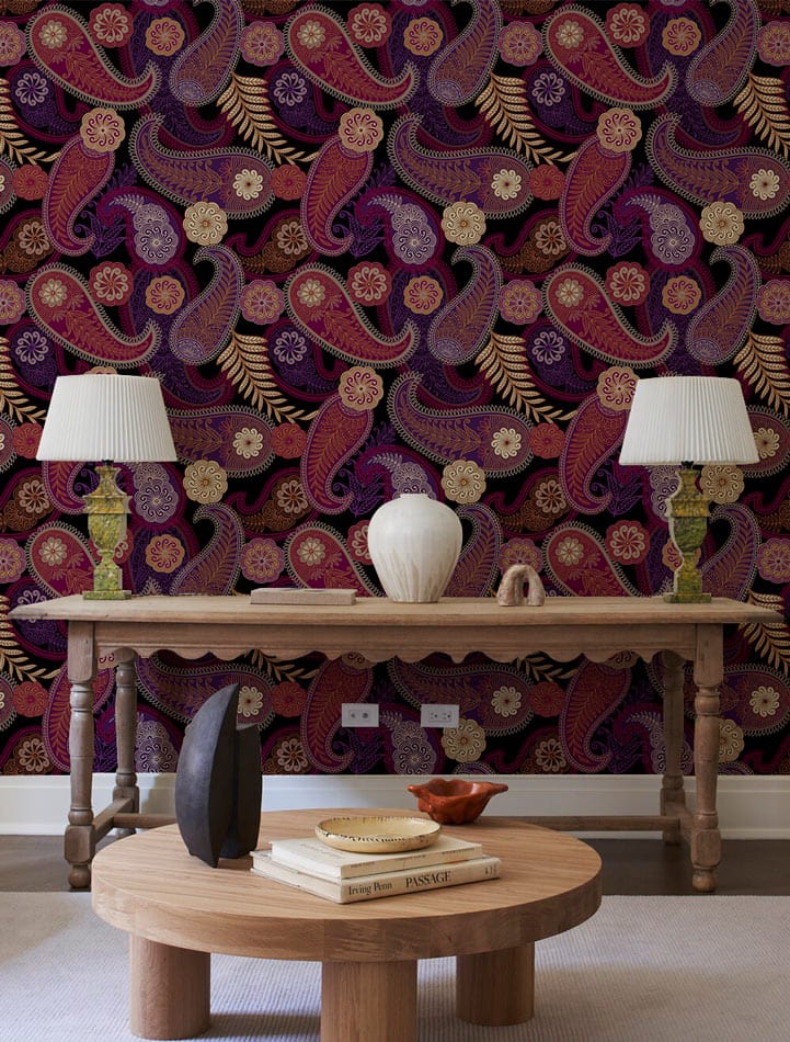 Vintage Paisley Pattern Wallpaper, rich red and gold hues, table, wooden flooring, stylish lamps.