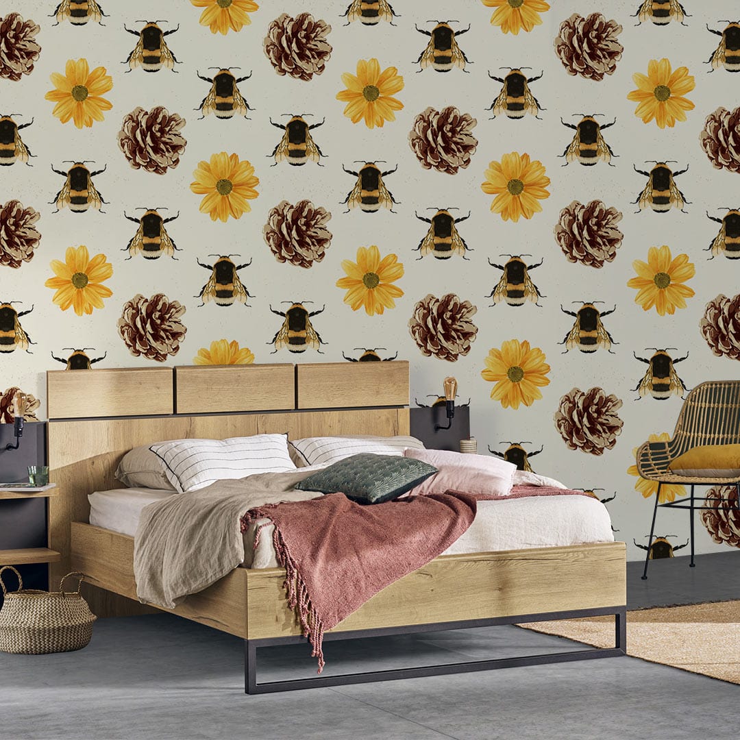 Vintage-inspired bee and floral yellow wallpaper in bedroom with wooden bed and grey flooring.