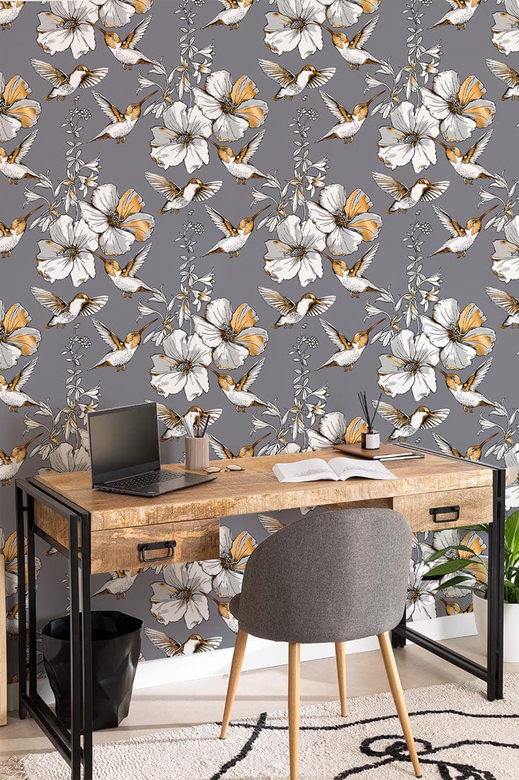 Elegant grey floral wallpaper with butterflies in modern office, wooden desk, grey chair, beige rug.