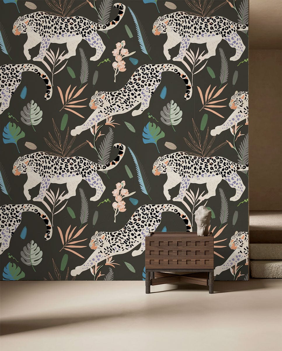 Exotic Jungle Leopard Pattern Wallpaper with earthy tones, dark wicker chair, neutral carpet, living room.