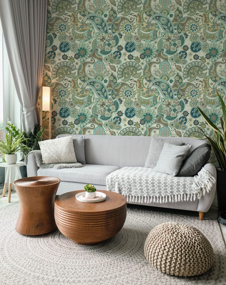 Vintage Paisley Elegance wallpaper, teal and beige, grey sofa, wooden tables, cosy living room setting.