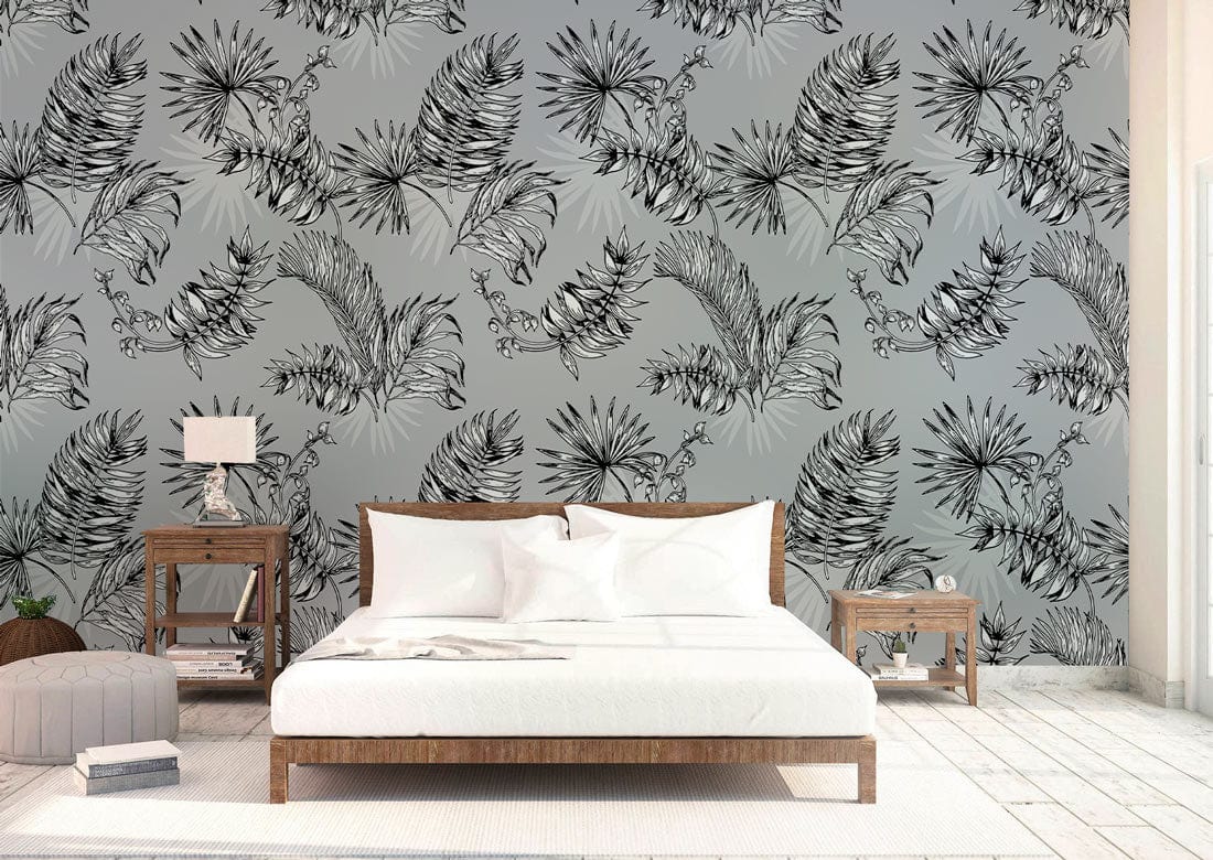 Elegant Monochrome Tropical Leaves Wallpaper; stylish grey design in modern bedroom with wooden bedframe and white floor.