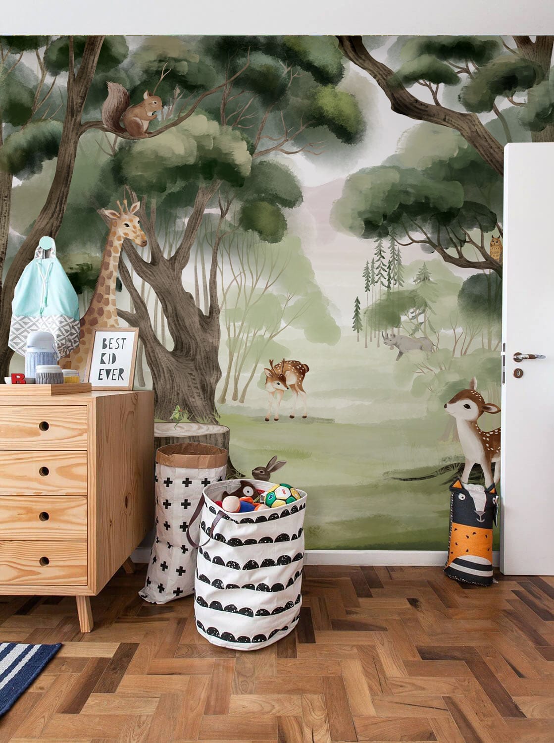 Whimsical Forest Animals Mural Wallpaper in children's room with wooden flooring and playful decor.