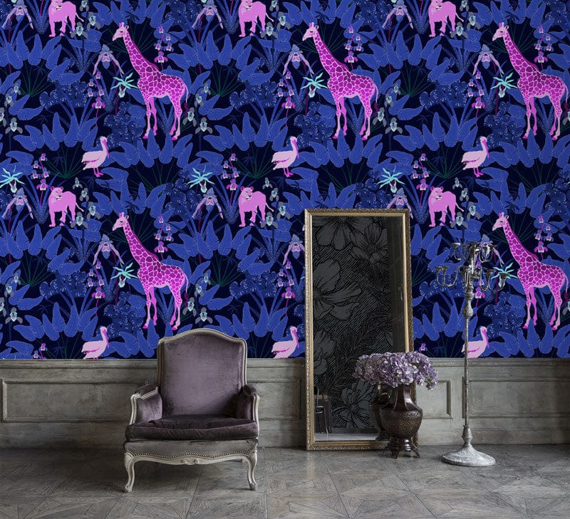 Vibrant Jungle Nights purple safari animal wallpaper with vintage armchair, wooden floor, and decorative mirror.